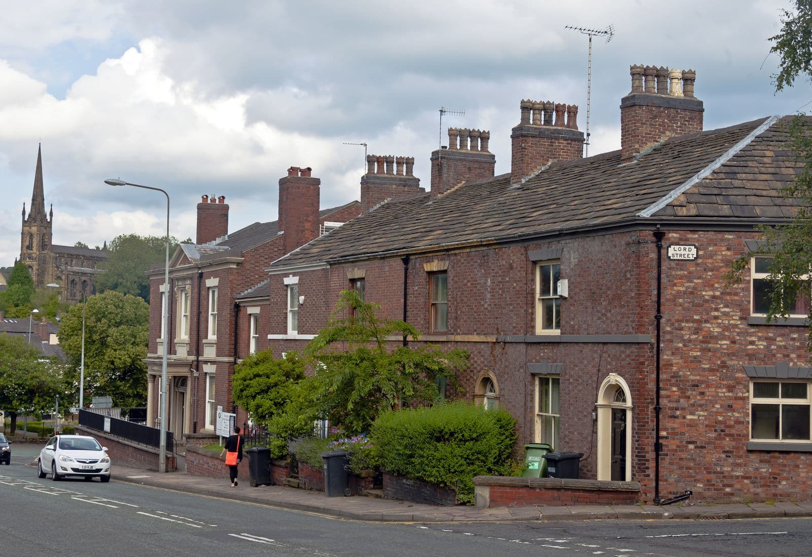 Brick houses with slate roofs on Sunderland Street at Lord Street, Macclesfield