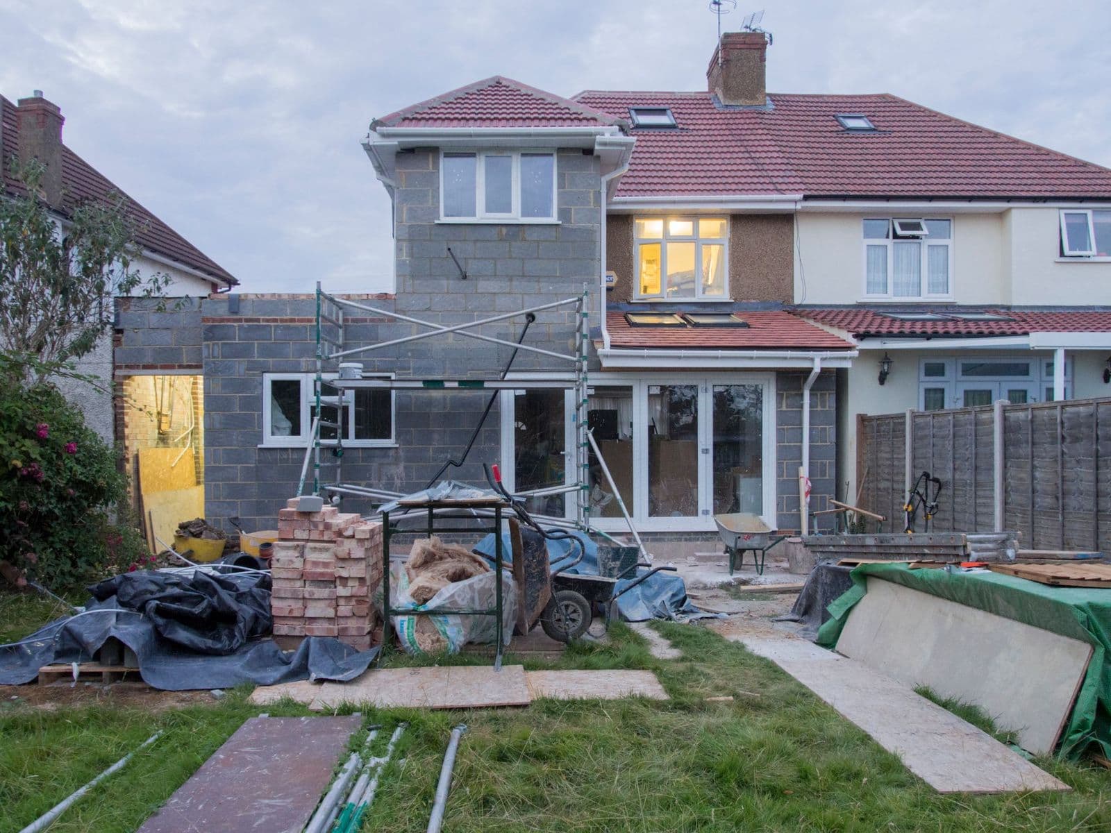 A semi-detached house with a single-storey rear extension under construction