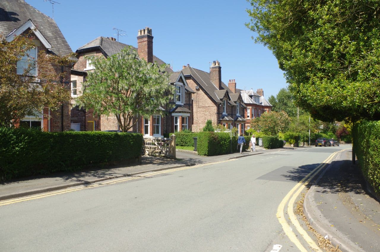Victorian brick villas with steep roofs and gables on Trafford Road, Alderley Edge