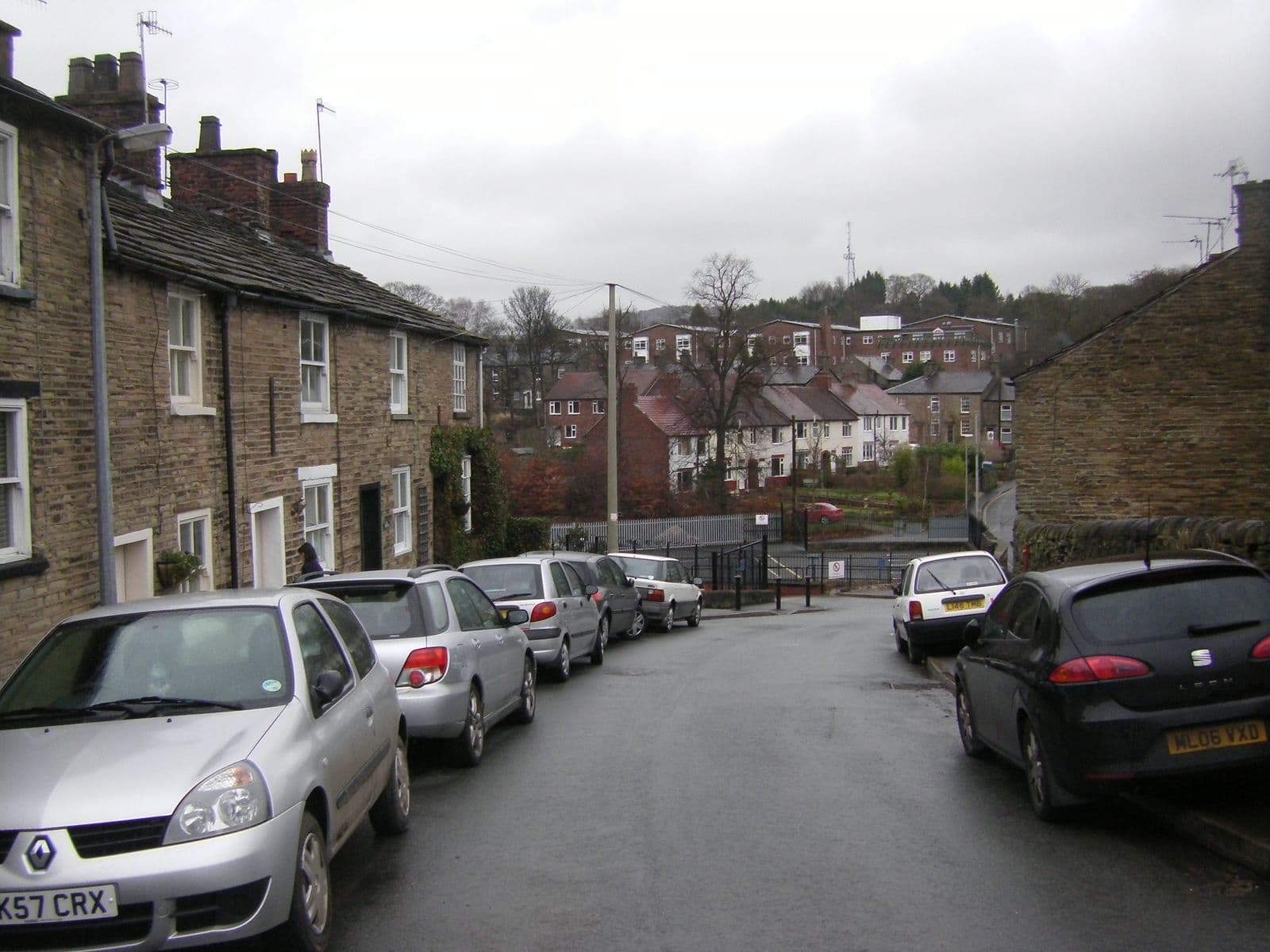 Stone terraced houses with slate roofs on Lord Street, Bollington