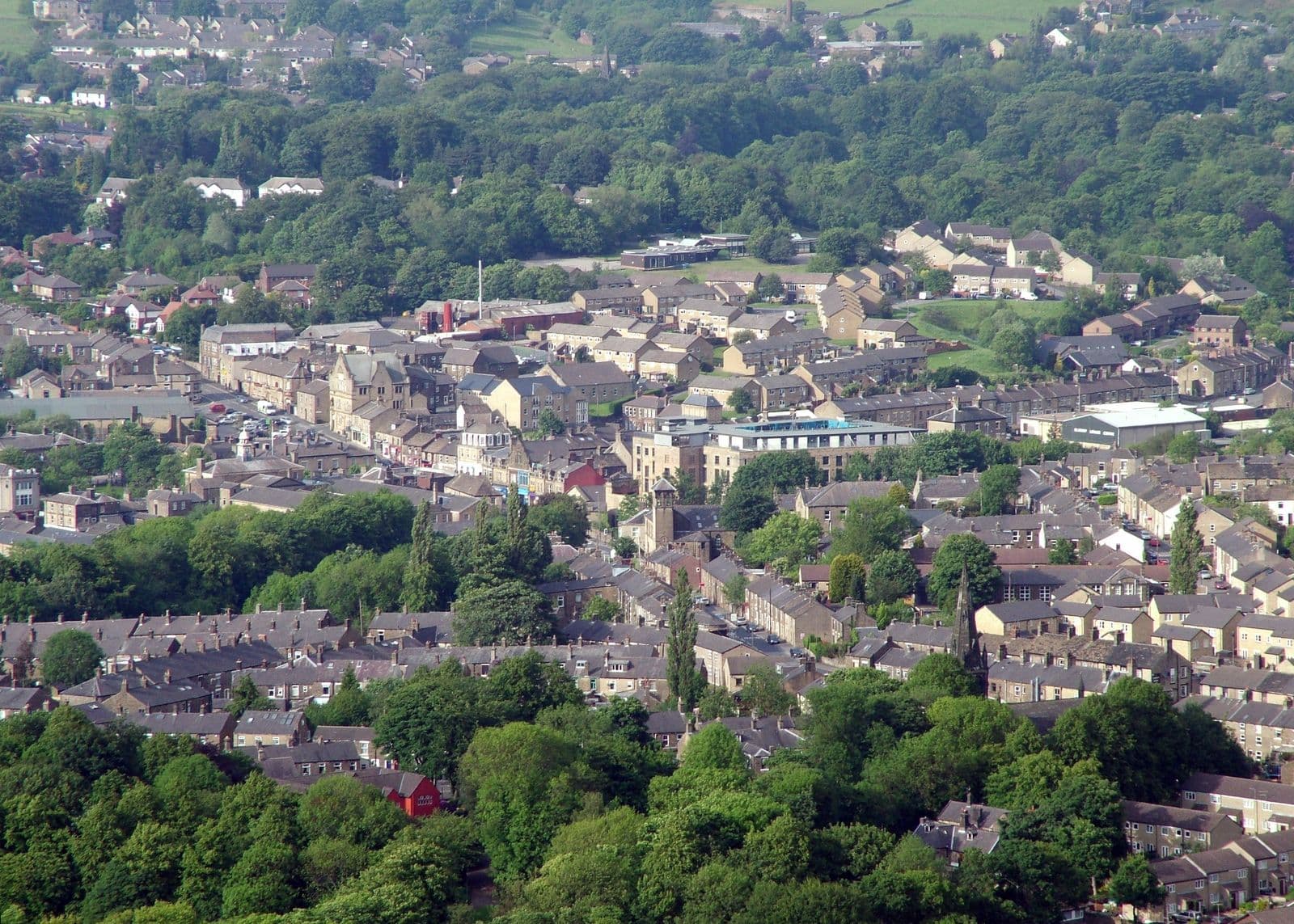 Rows of gritstone terraced houses and mills across Glossop