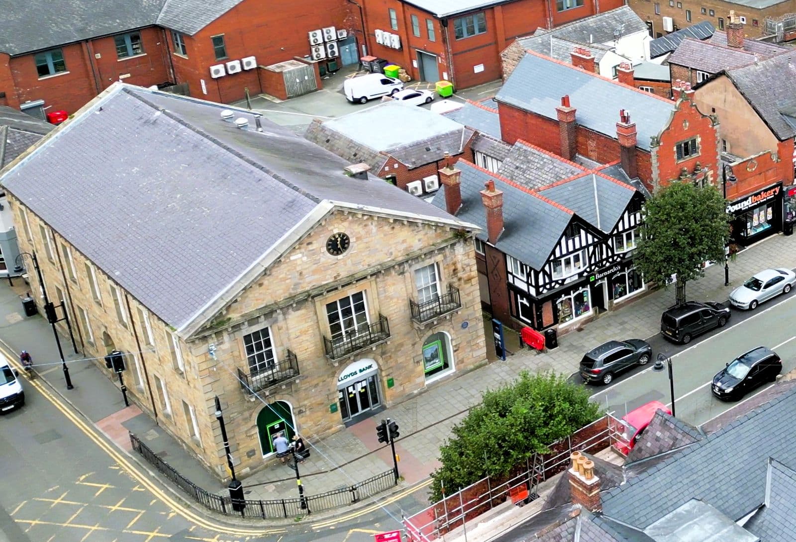 The former Market Hall and slate roofs of the town centre in Mold, from above
